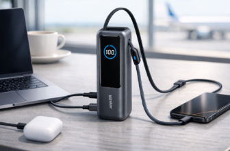 Anker A1695 25,000mAh Laptop Power Bank with built-in retractable USB-C cables charging a laptop and phone.