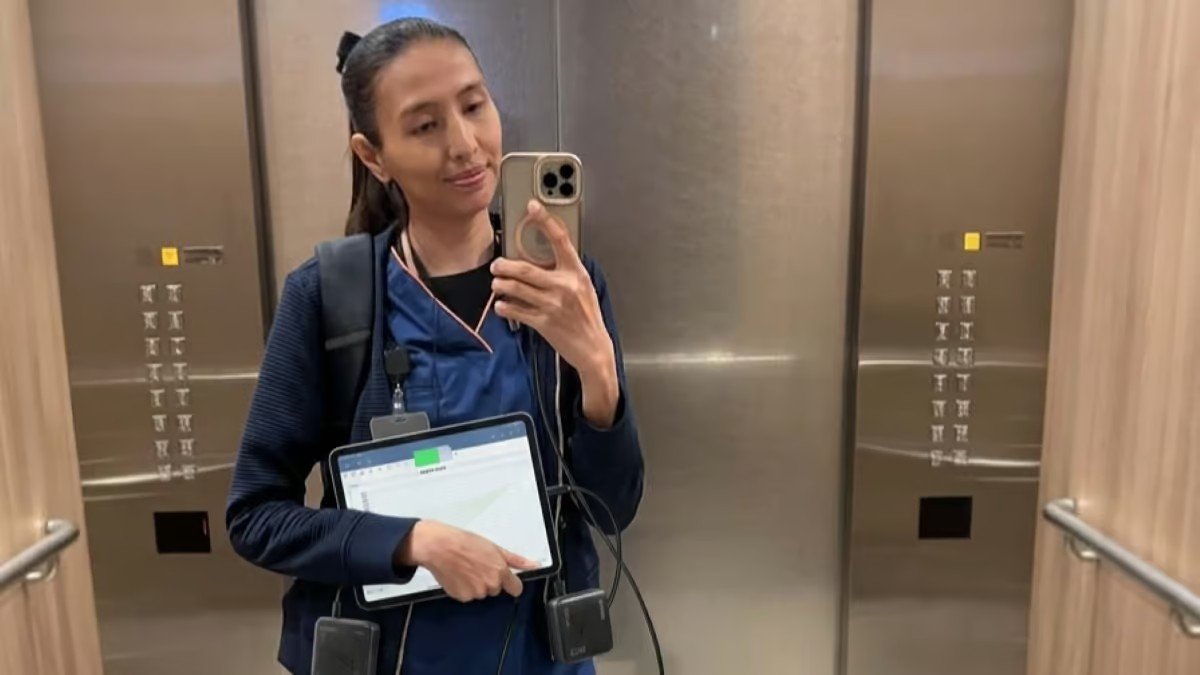 Nurse Darleene testing the Anker Nano 10K power bank during a nursing shift, showing its compact size in a scrub pocket.