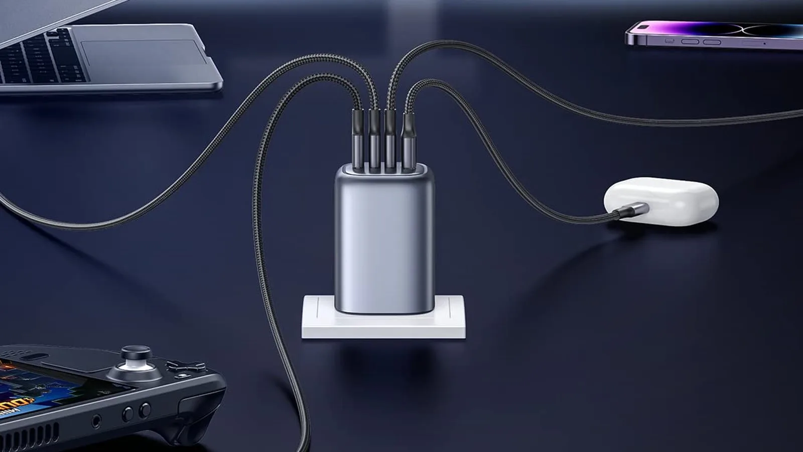 UGREEN Nexode 100W 4-port USB-C charger running a laptop, phone, earbuds and a handheld console