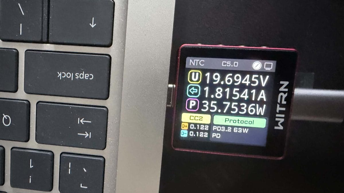 WITRN USB tester showing LISEN Qi2.2 power bank PD3.2 63W protocol offer at full charge