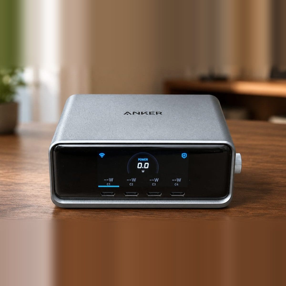 Anker Prime 250W charger on a desk with its LCD display facing the viewer