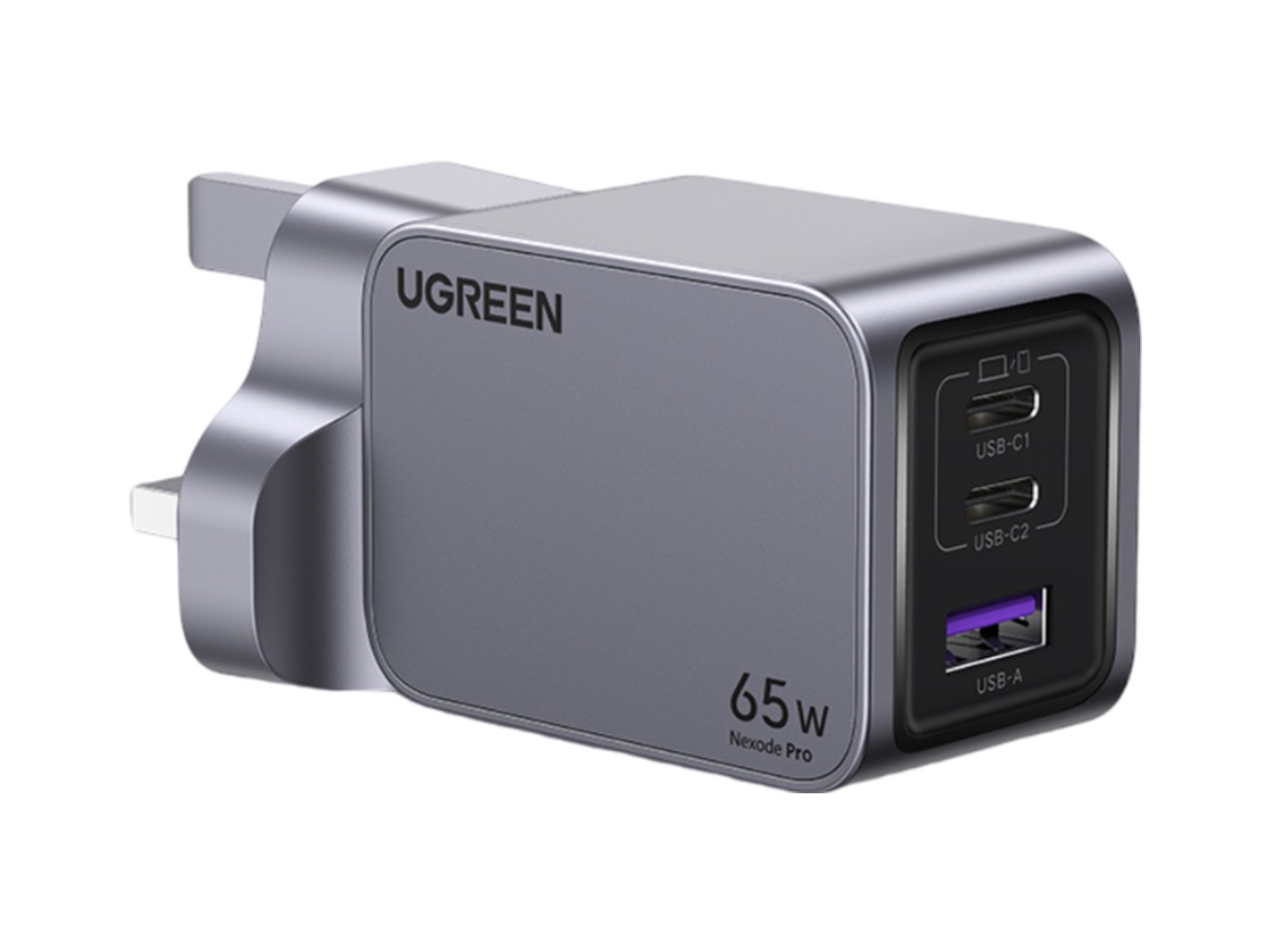 UGREEN Nexode Pro 65W GaN charger powering a laptop, phone and earbuds from its three ports